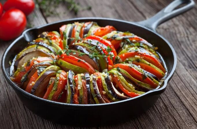 Garnish with tomatoes and zucchini